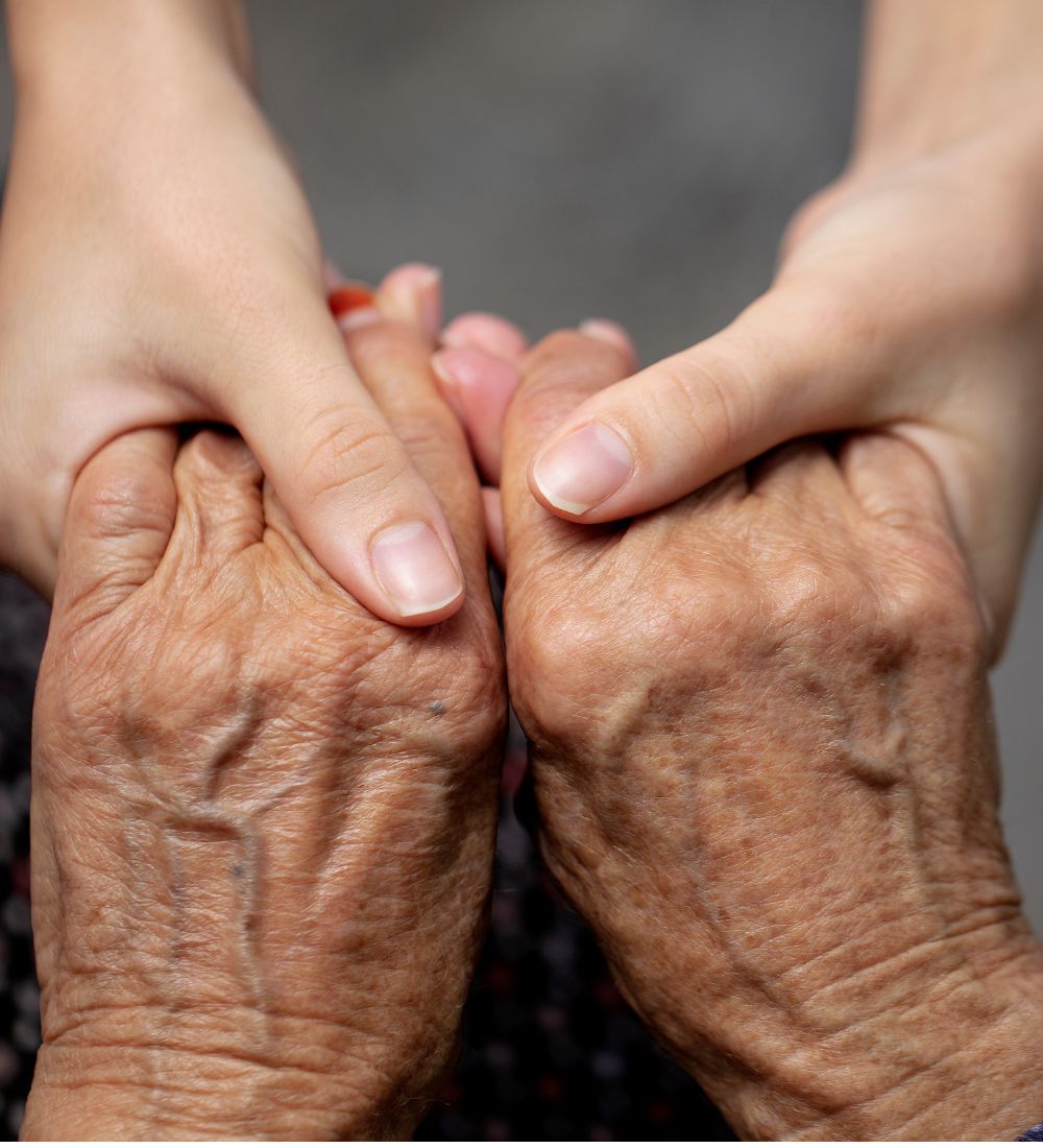 holding hands at assisted living image