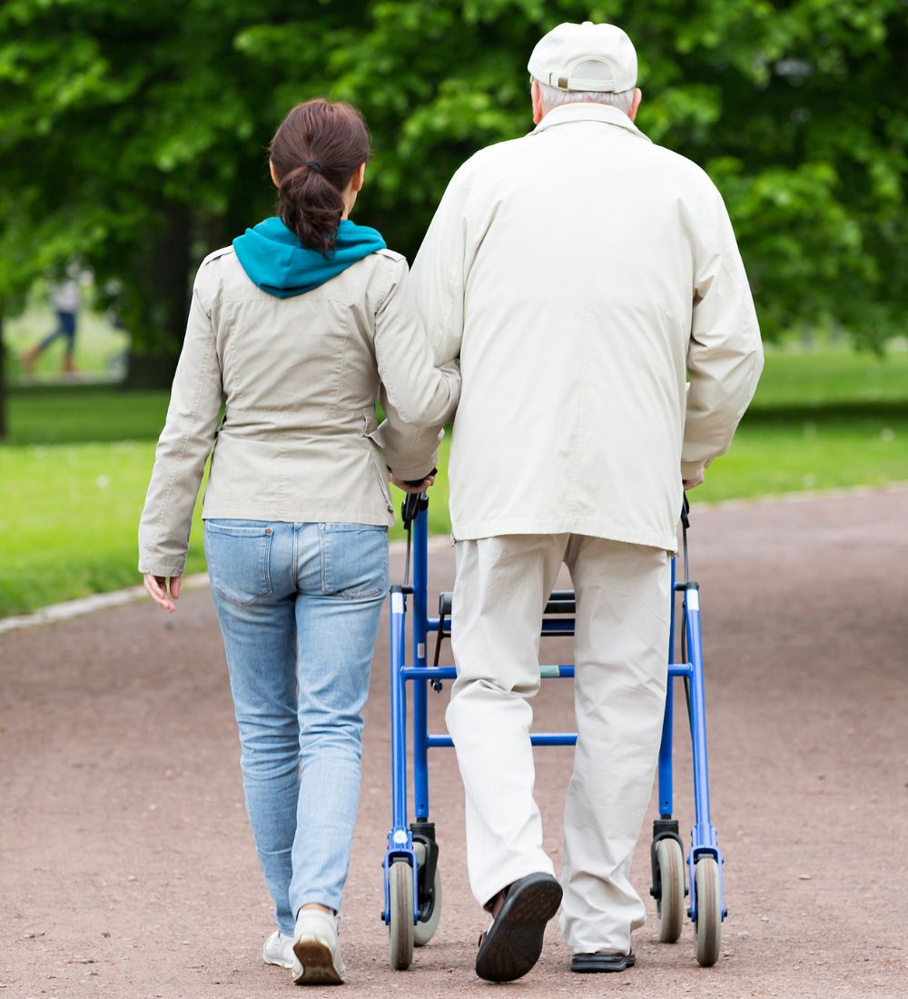 man and woman walking in assisted living image