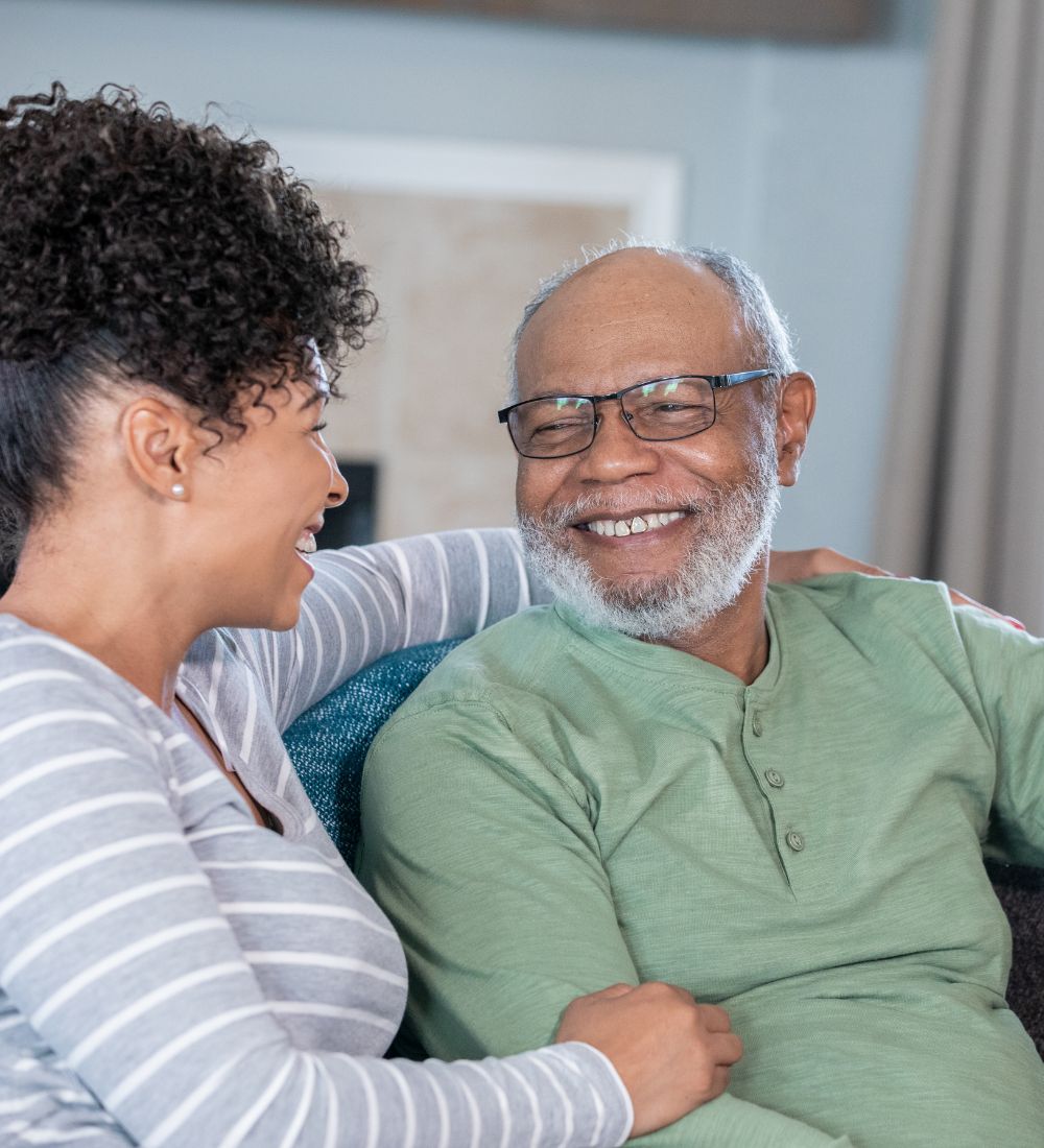 old man and woman laughing in assisted living image